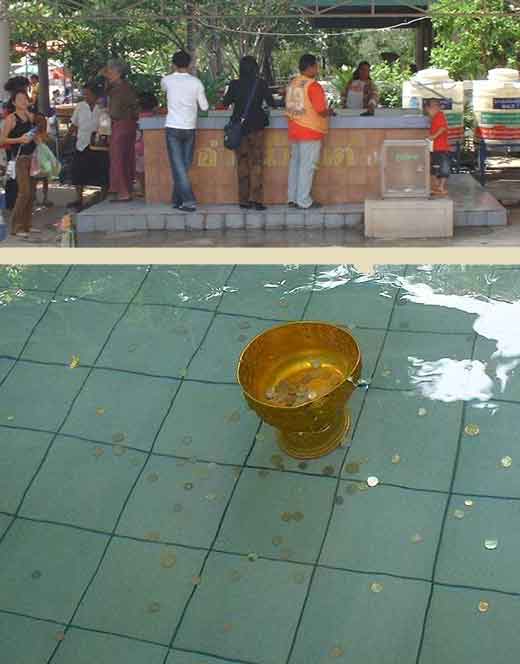 Bassin pour eau bénie dans un temple thai.